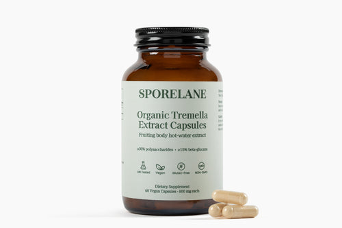 Front label of Sporelane Organic Tremella Extract Capsules with vegan capsules beside the bottle